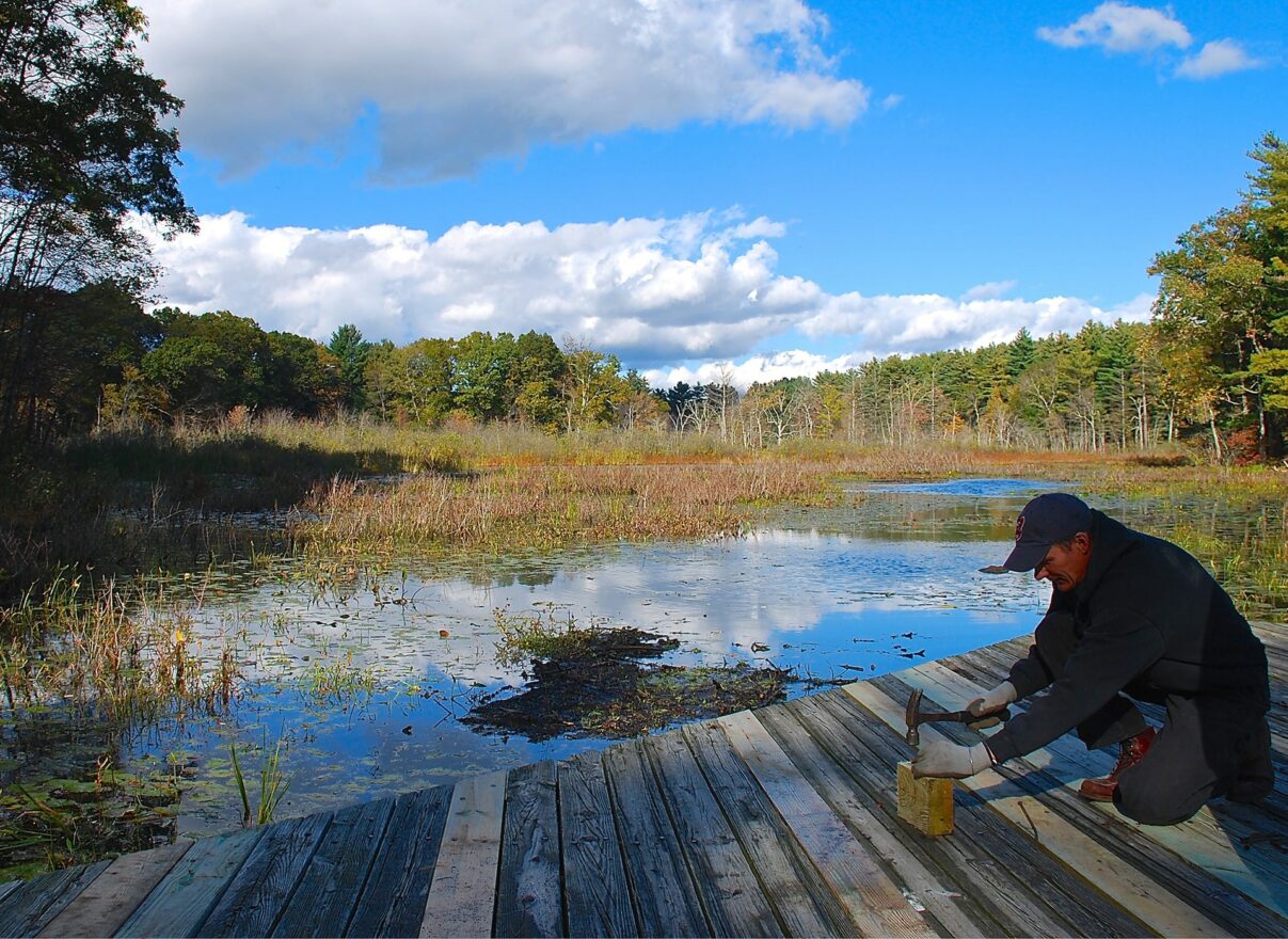 man by pond